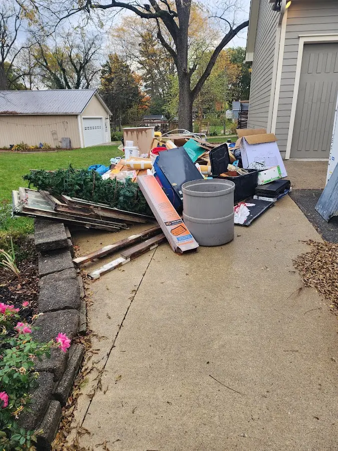 Dumpster being loaded with debris for Estate Cleanout Dumpster Rental in Larkfield-Wikiup